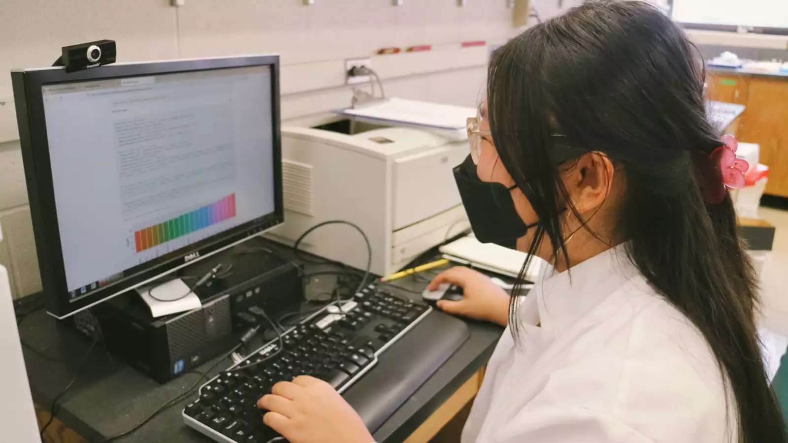 Tiffany Vo coding in the lab