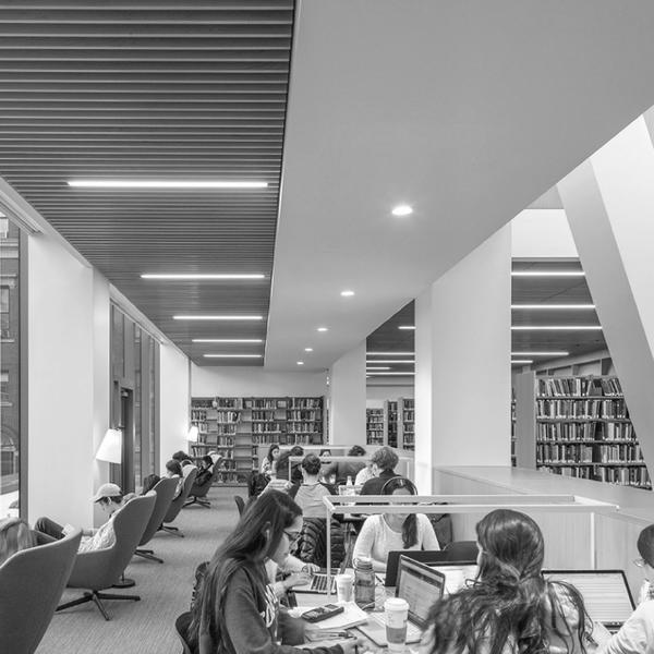 black and white image of students studying at the Barnard Library