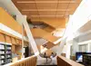 Students on the second floor of Milstein chatting and students going up stairs